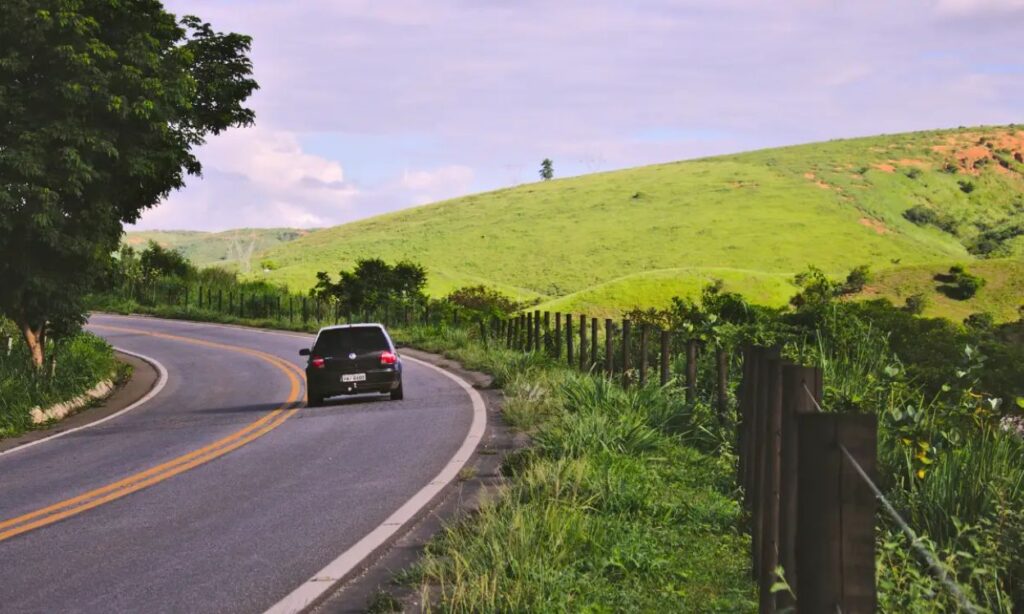 Scenic road trip during monsoon season from Delhi with greenery and rain-soaked landscapes